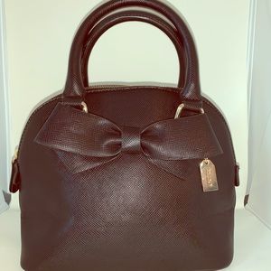 Black purse with bow detail